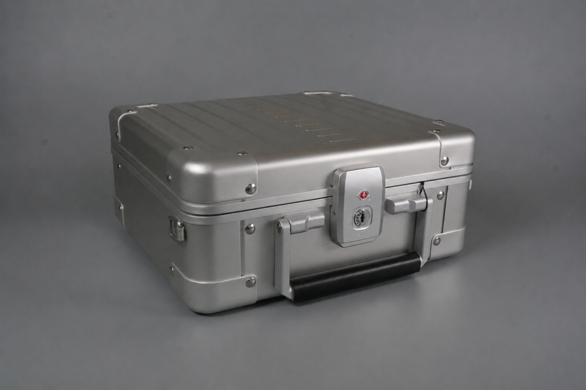 Aluminium personal item flight case with a durable hard shell, designed for travel and everyday carry