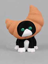 Black and white cat bread collectible displayed with the croissant accessory.
