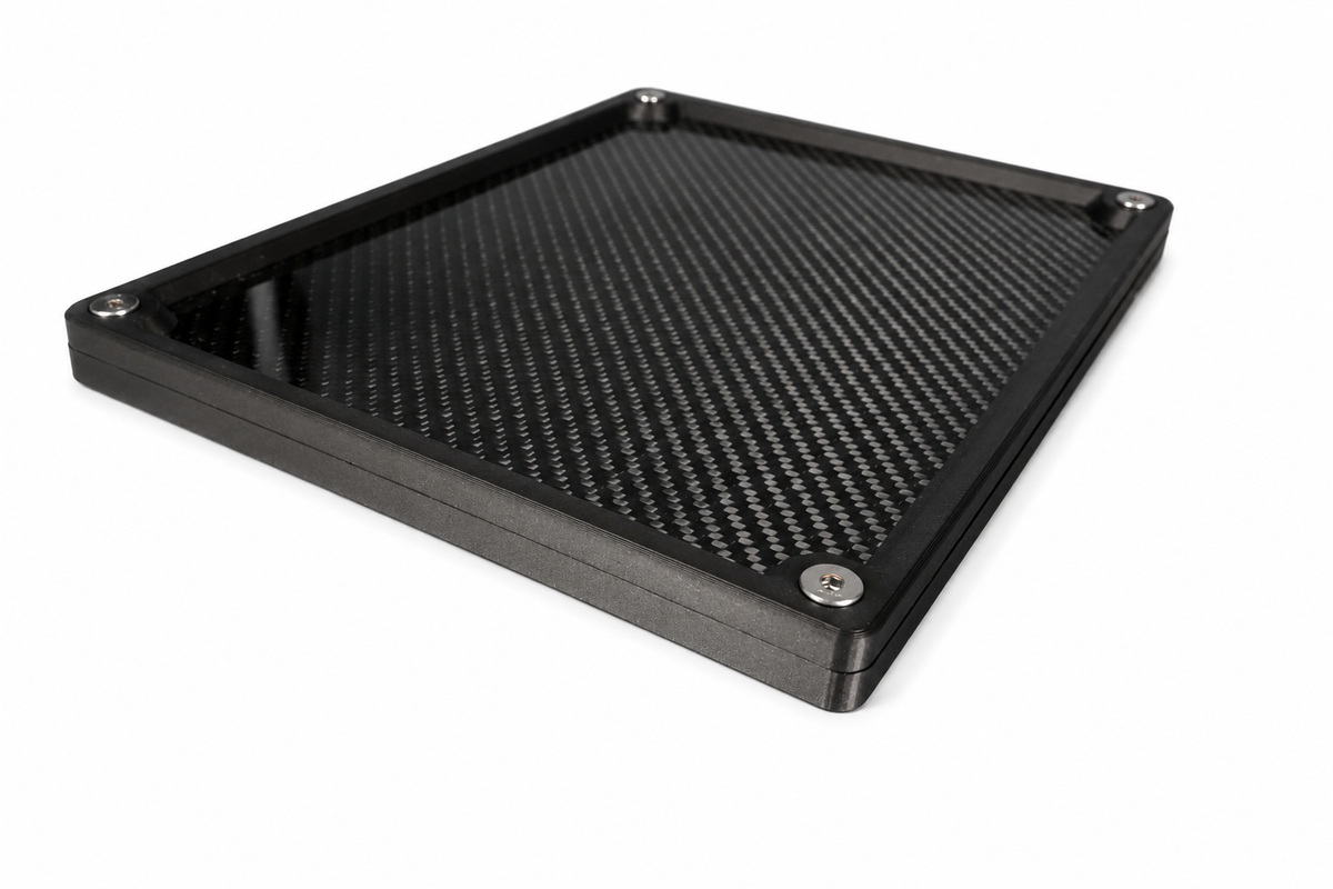 Angled view highlighting the real carbon fibre finish and spacious compartments of the organiser tray.