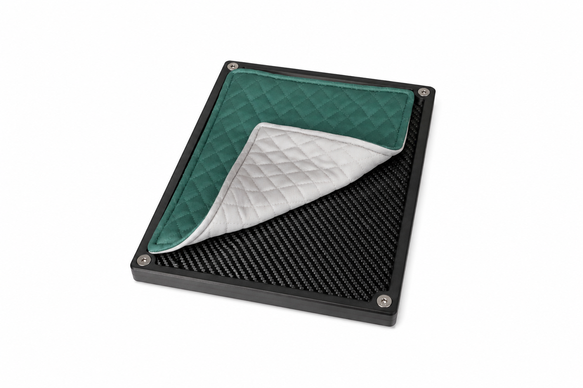Folded racing green quilted valuables cloth with a soft quilted finish.