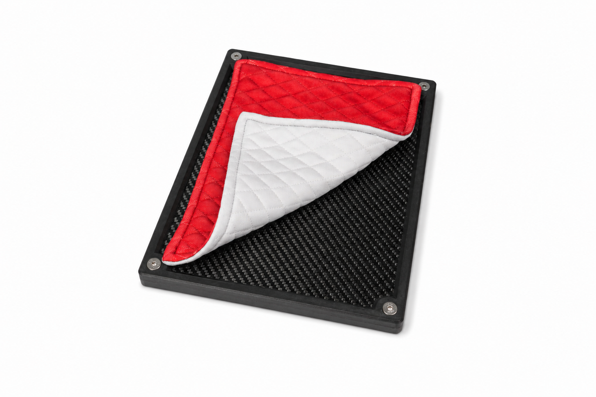 Folded red quilted valuables cloth showing the soft padded construction.