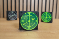 Angled view of multiple radar wall clocks displaying the available design options.