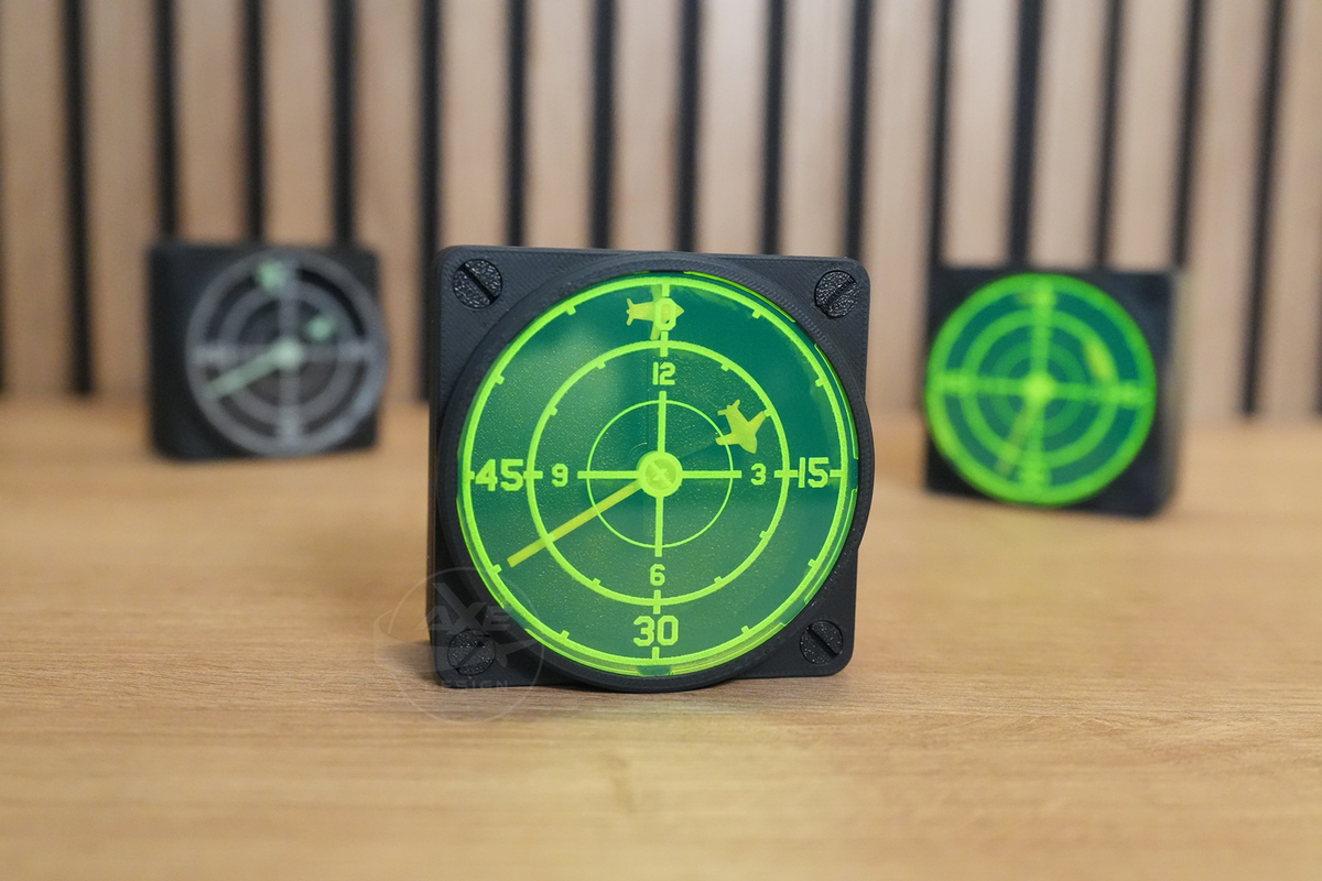 Angled view of multiple radar wall clocks displaying the available design options.