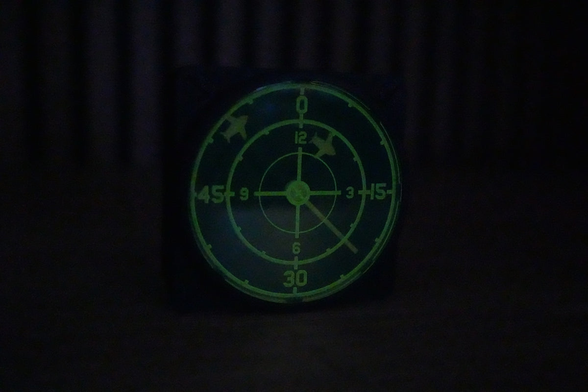 Green radar wall clock showcasing the glow-in-the-dark radar sweep effect.